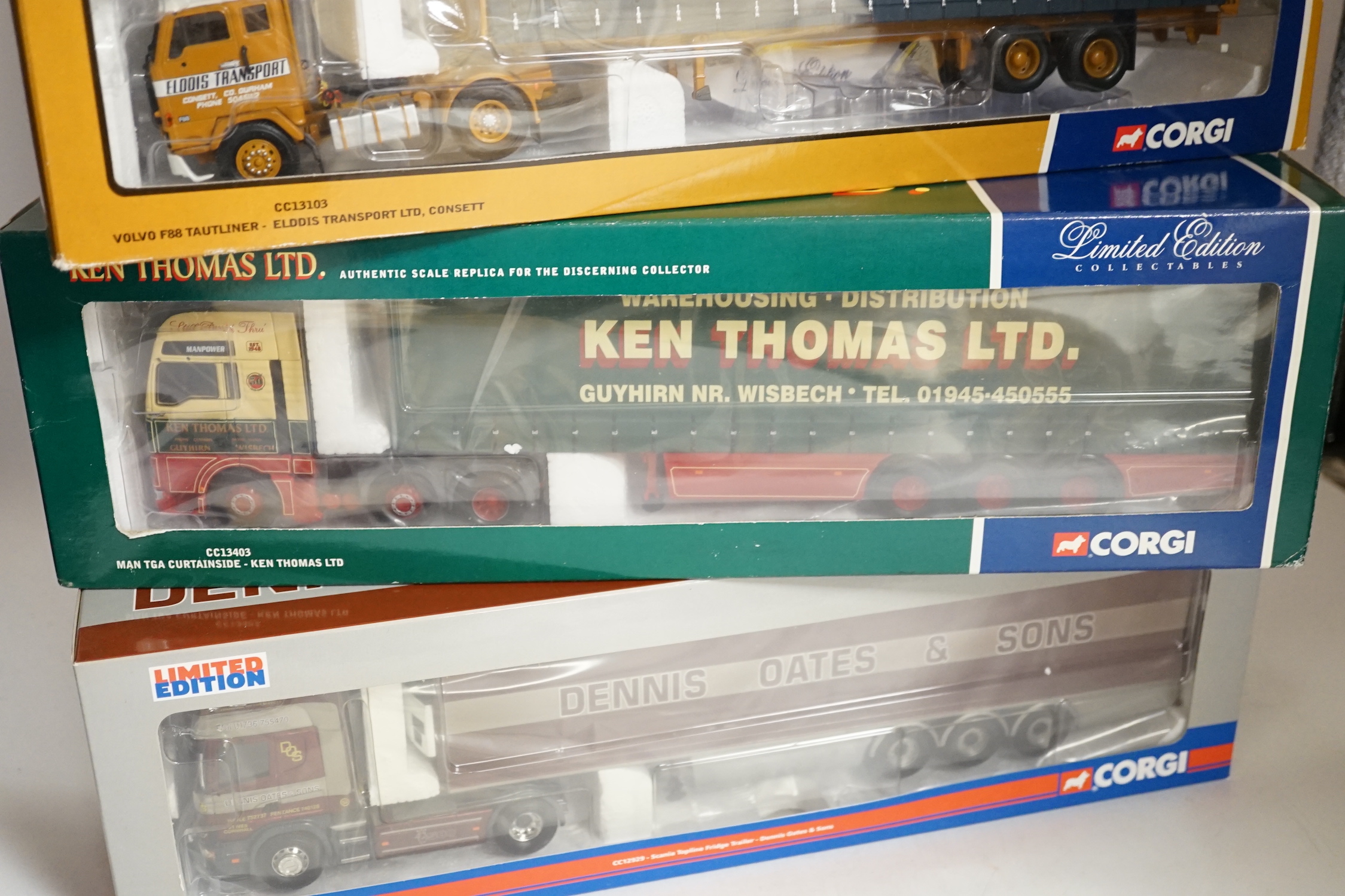 Four boxed Corgi 1:50 scale articulated trucks; a DAF XF Space Cab Curtainside lorry (CC13227), a MAN TGA curtainside lorry (CC13403), a Scania Topline with Fridge Trailer (CC12929) and a Volvo F88 Tautliner curtainside